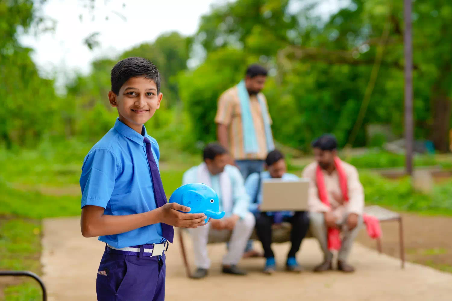 importance-saving-concept-smart-indian-little-boy-standing-holding-piggy-bank-hand-home